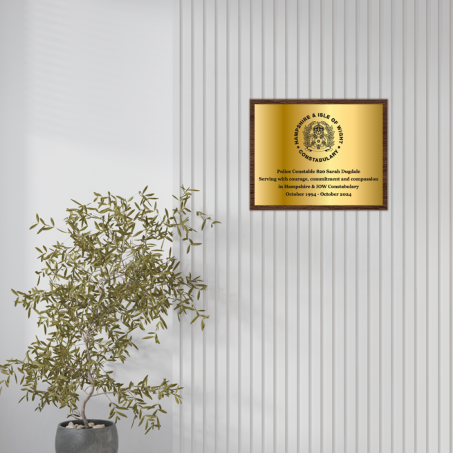 Wall Mounted Gold Plaque with Wooden Backing on Wall