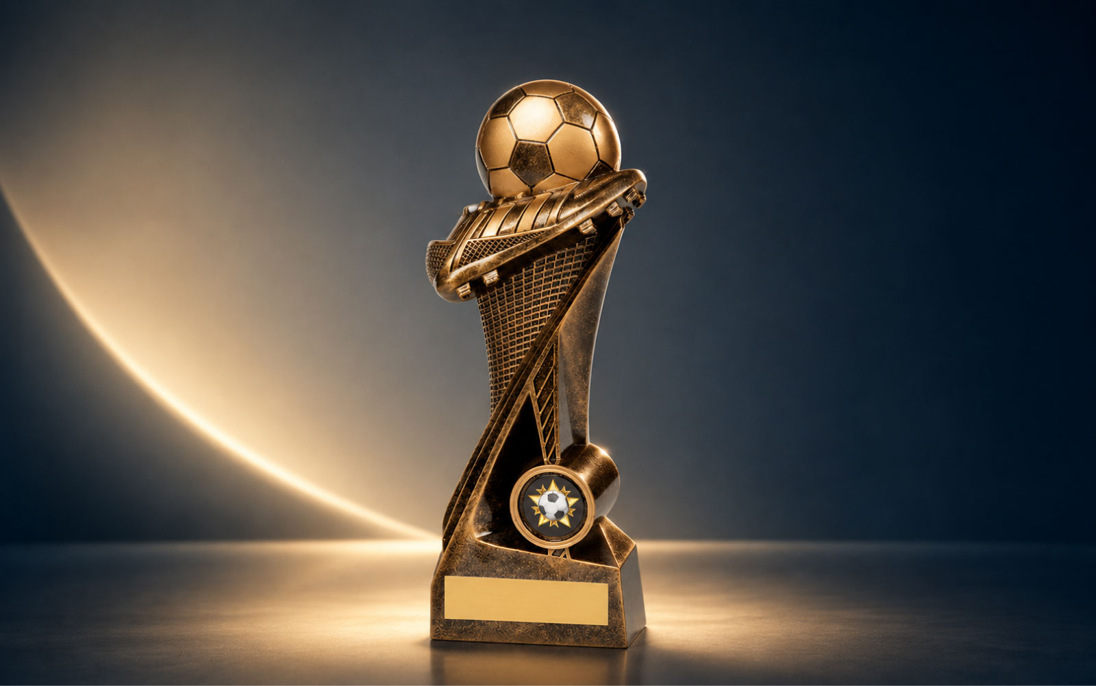 Football presentation trophy displayed in a stadium setting.